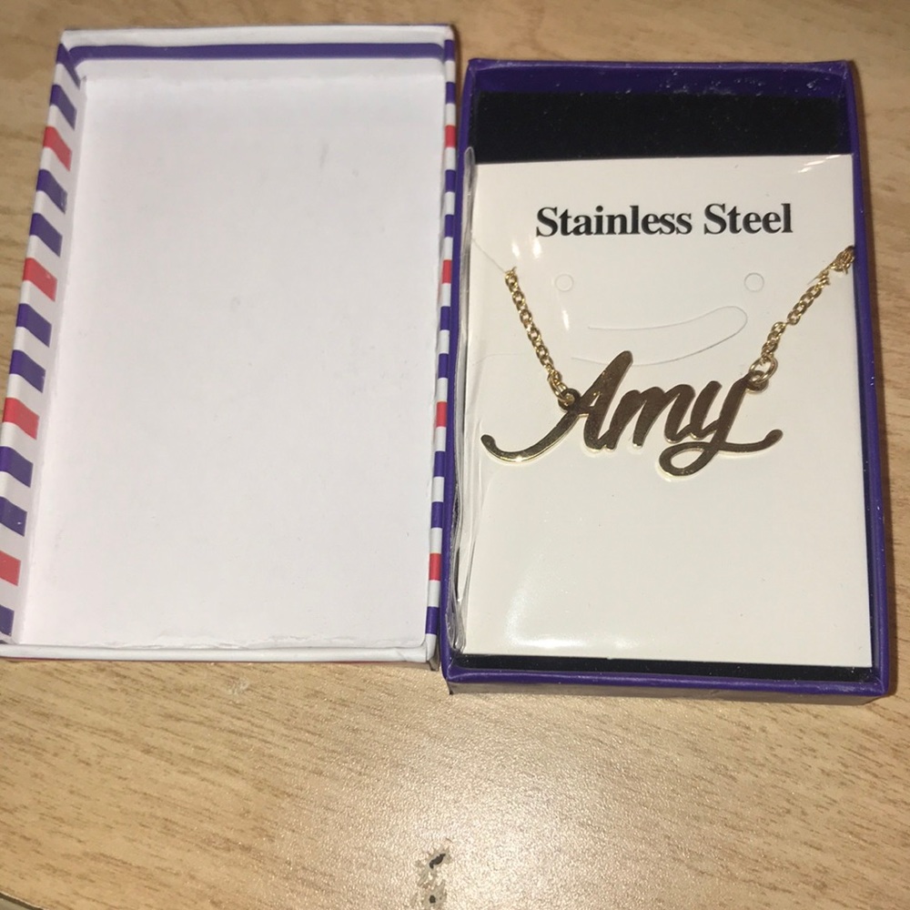 Gold name necklace.